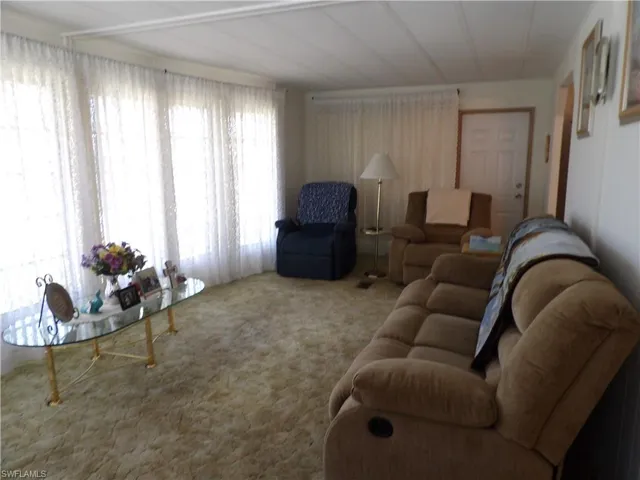 Living room view of carpeted living area