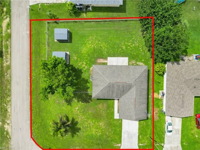 Aerial overview of property's location with property parcel outlined