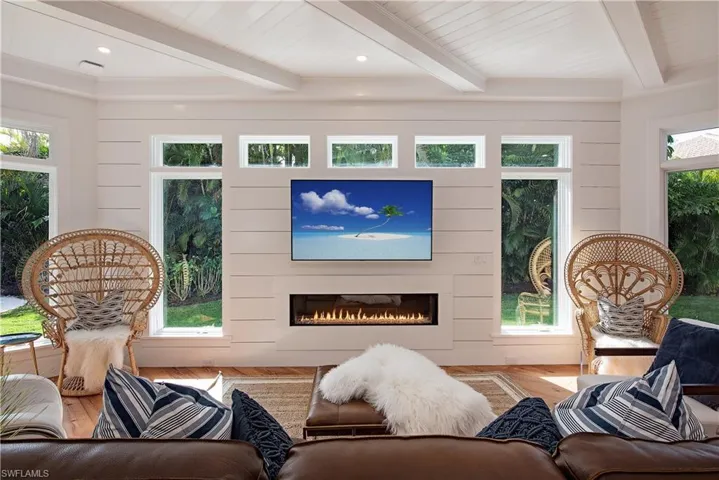 Spacious Family Room with tons of windows, light and contemporary gas fireplace.