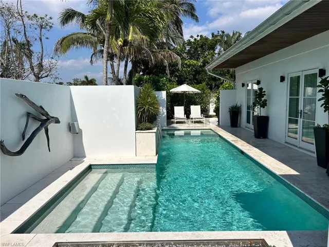 Full enclosed cabana style lap Pool and hot tub
