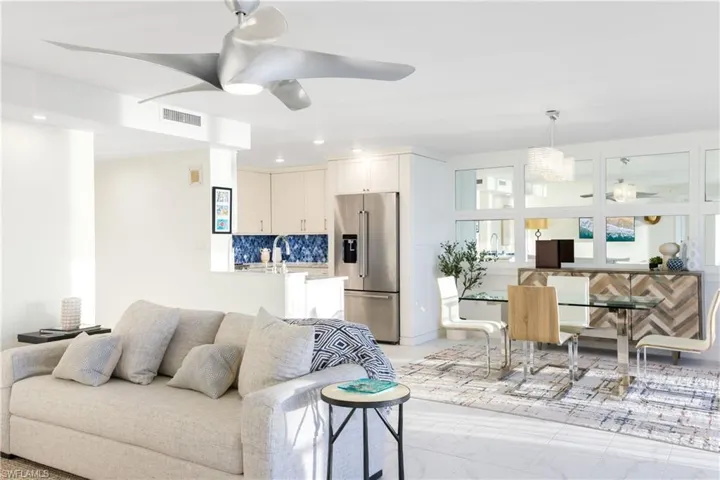 Living area with ceiling fan and recessed lighting