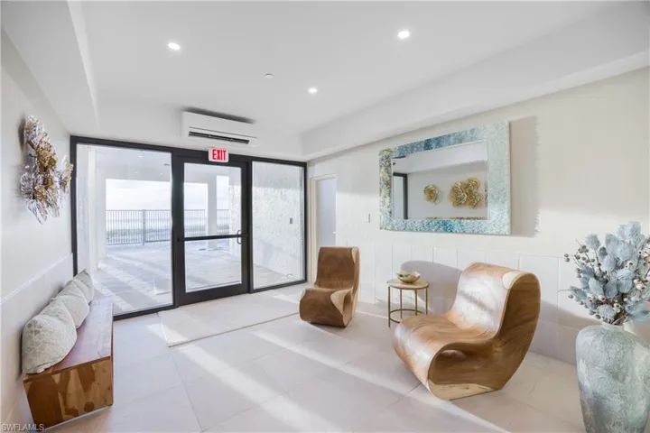 Lobby featuring floor to ceiling windows and recessed lighting