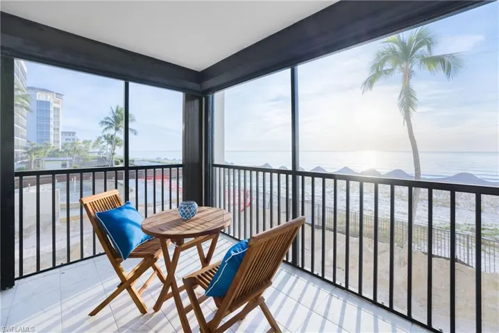 Sunroom / solarium with a water view