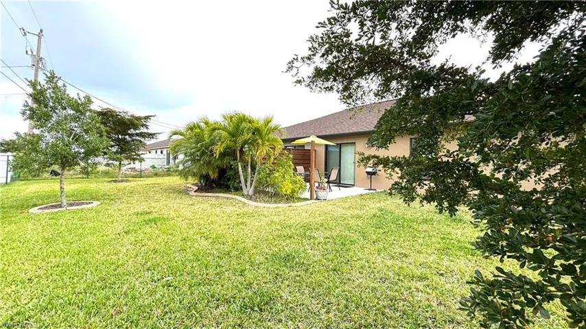 Fenced yard is meticulously maintained.