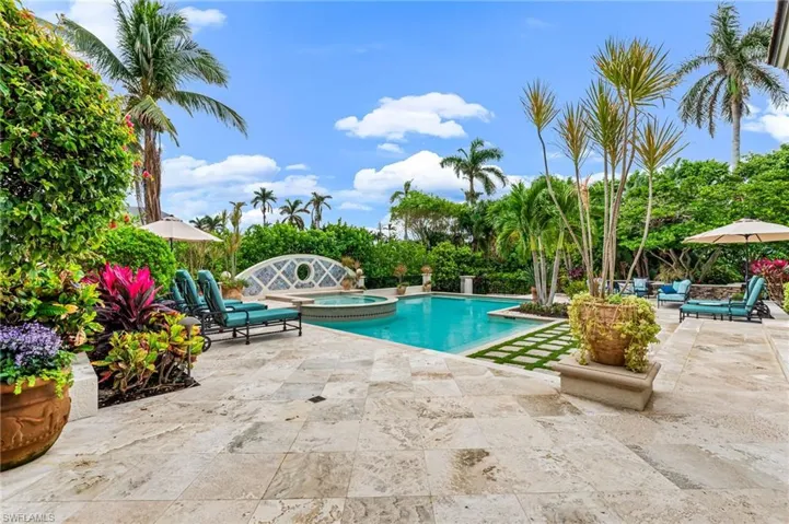 View of pool featuring an in ground hot tub and a patio
