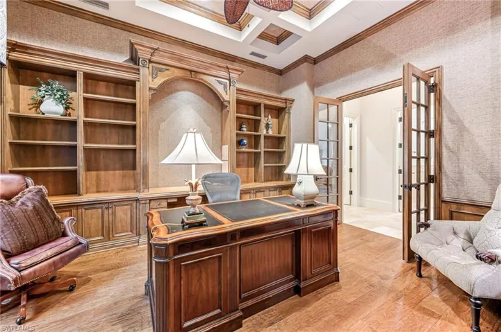 Office featuring french doors, ornamental molding, coffered ceiling, light hardwood / wood-style flooring, and beamed ceiling