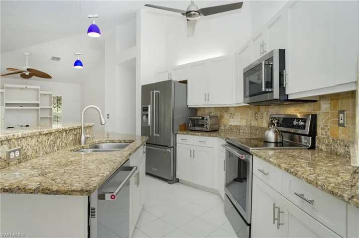 Dining space featuring an inviting chandelier and light tile flooring