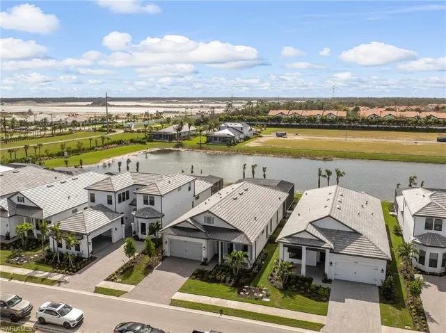 Aerial view of residential area with a large body of water