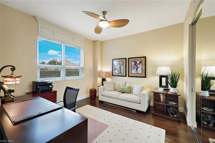 This third bedroom with a pull out sofa is currently used as an office, but can easily be converted to a bedroom with a full customized closet.