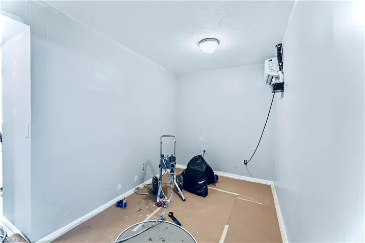 Exercise room featuring a textured ceiling