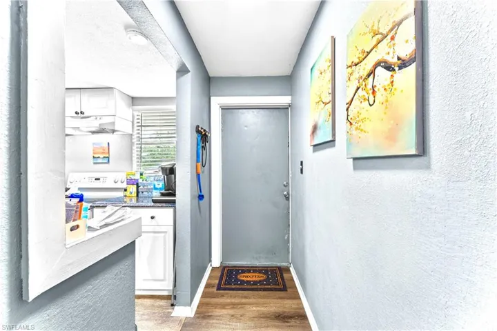 Entryway featuring hardwood / wood-style floors and a textured ceiling