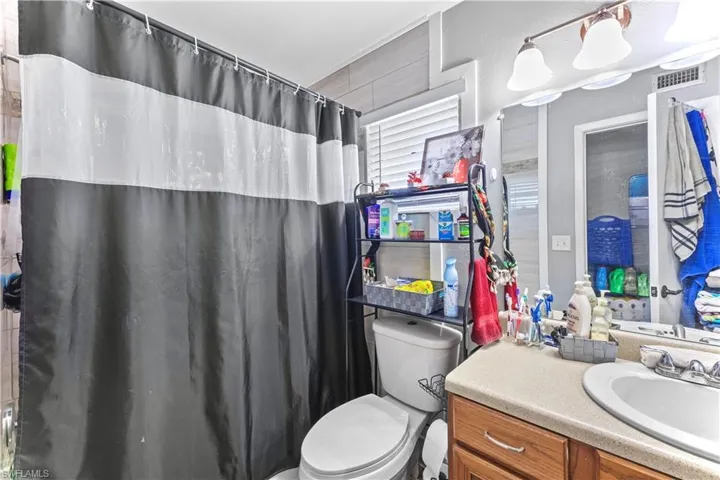 Bathroom with vanity and toilet