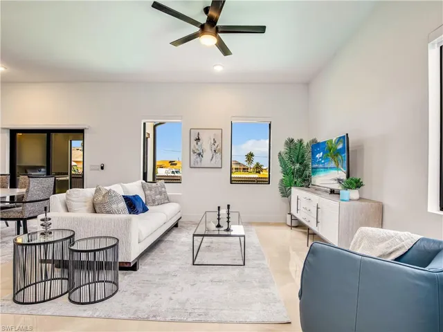 Living area featuring a ceiling fan and recessed lighting