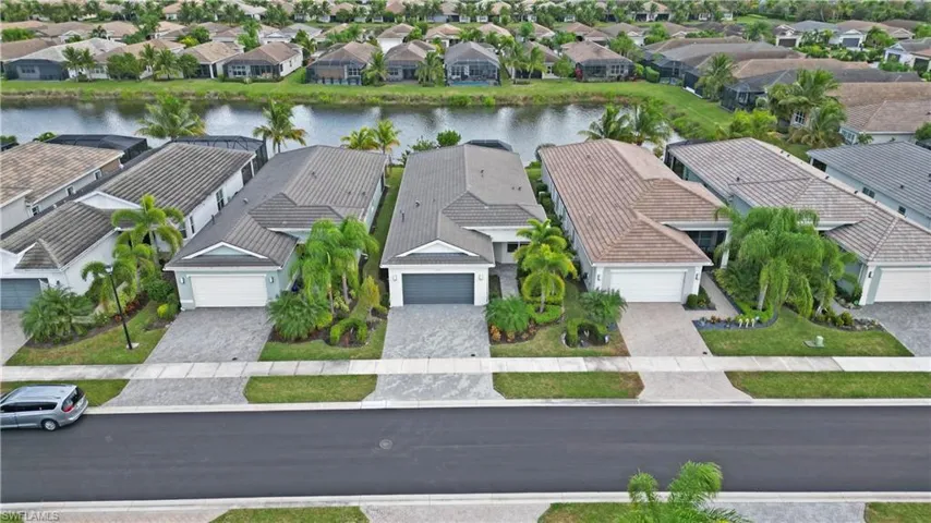 Aerial perspective of suburban area with a large body of water