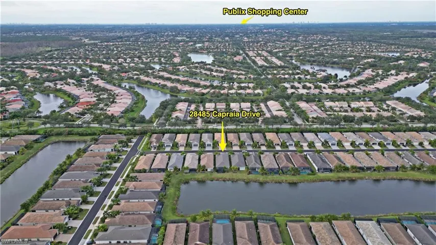 View of property location featuring nearby suburban area and a large body of water