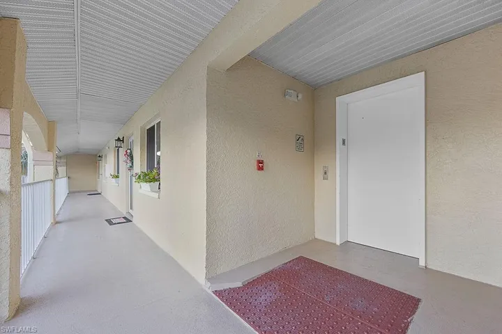 Entrance to property featuring stucco siding