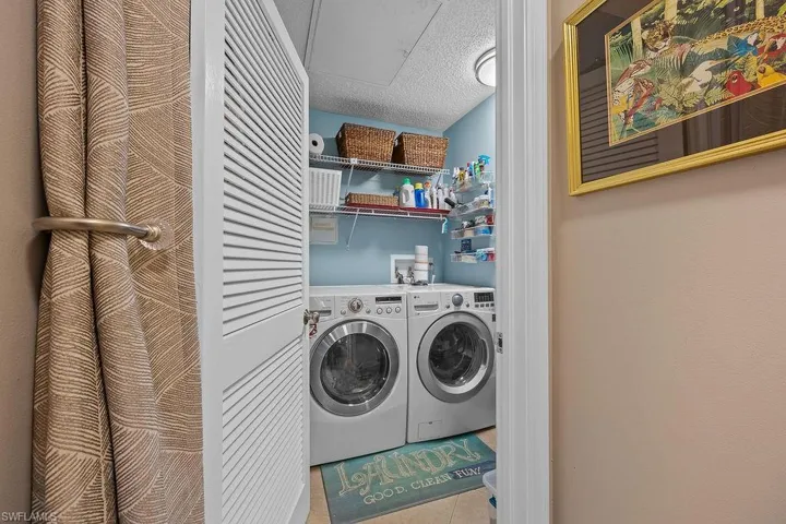 Laundry and utility room tucked into a great location and provides lots of storage.