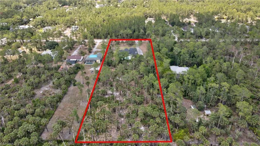 Aerial overview of property's location featuring a heavily wooded area and property parcel outlined