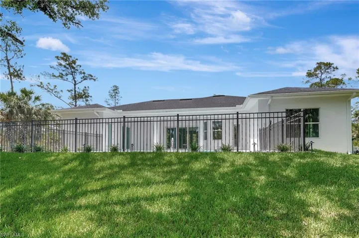 Rear view of property with stucco siding