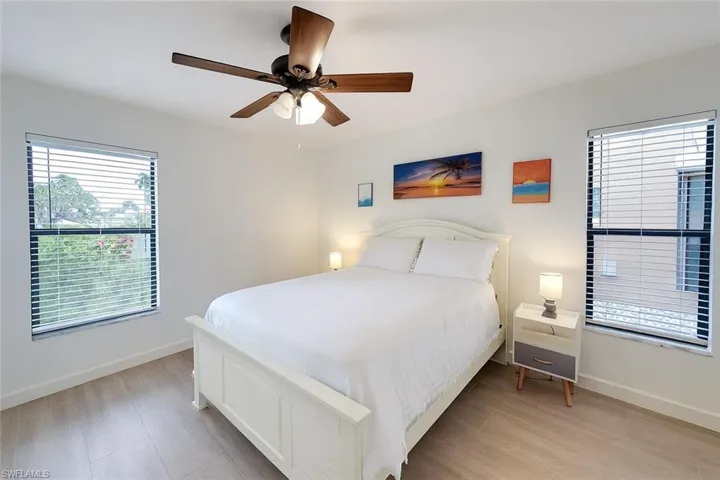 Bedroom featuring light wood-type flooring and a ceiling fan