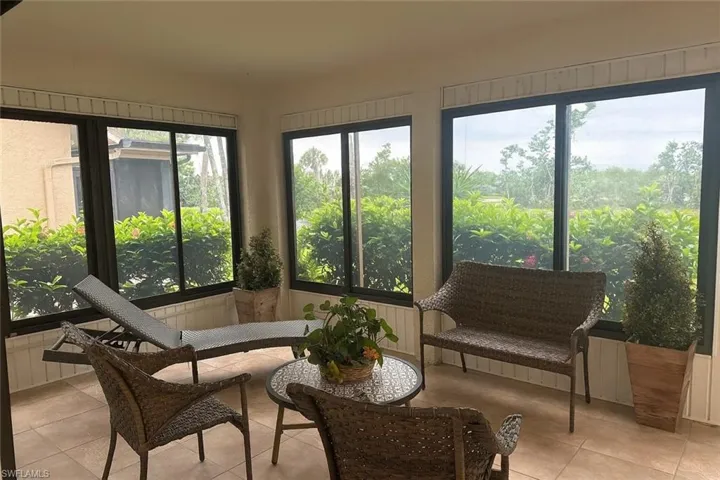 Sunroom featuring tile patterned floors