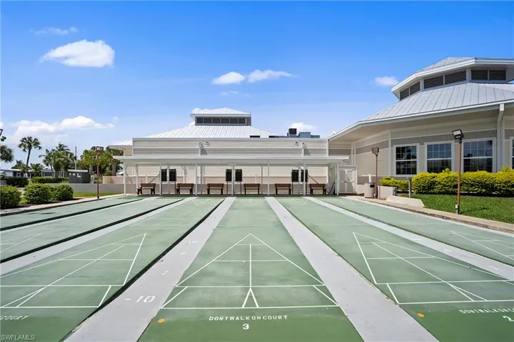 View of property's community with shuffleboard