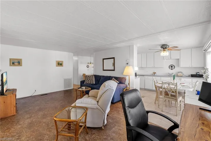 Living room featuring a ceiling fan