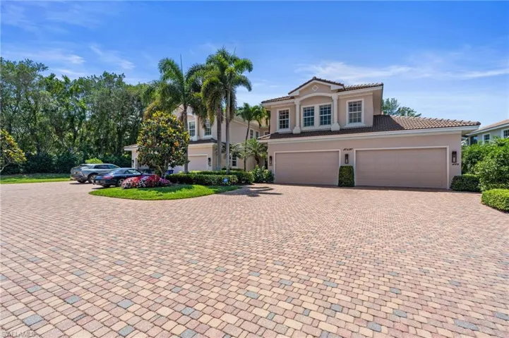 Mediterranean / spanish-style home featuring stucco siding, decorative driveway, an attached garage, and a tile roof