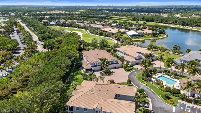 Aerial view featuring a residential view and a water view