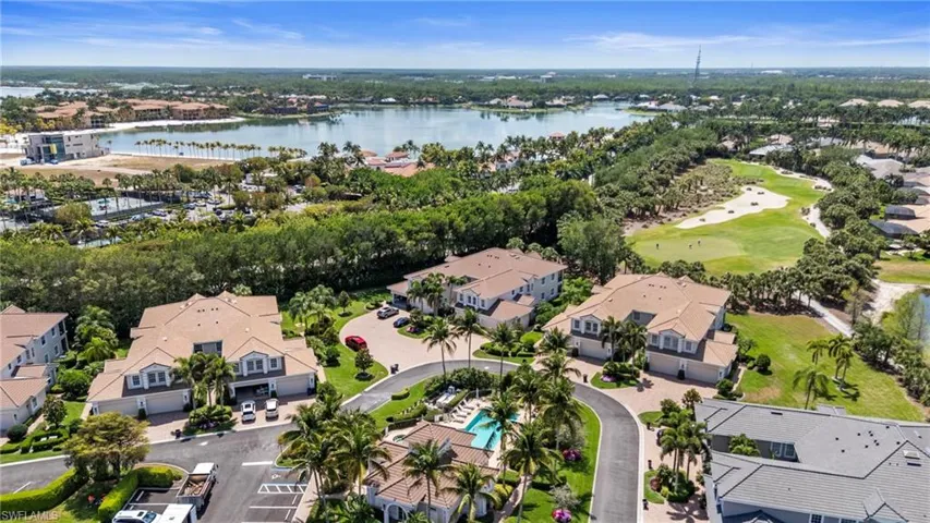 Birds eye view of property with a residential view, view of golf course, and a water view