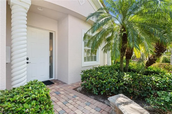 Property entrance with stucco siding