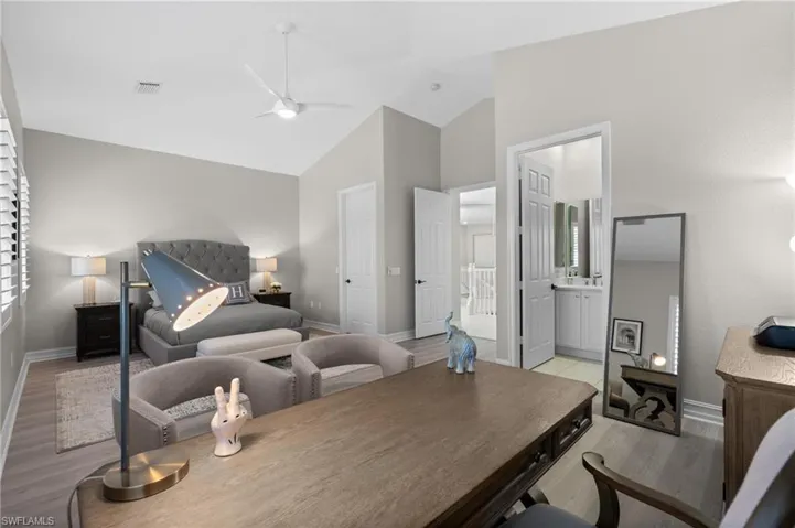 Bedroom with visible vents, baseboards, and light wood-type flooring