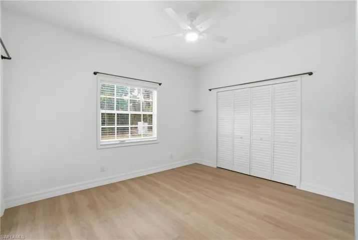 Guests will love this light-filled bedroom with its own French door entry to the deck and pool.