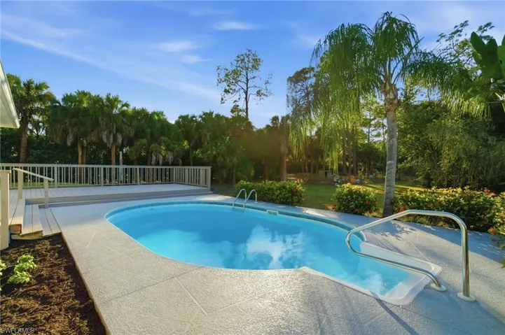 A private swimming pool paired with an expansive deck for lounging and outdoor enjoyment