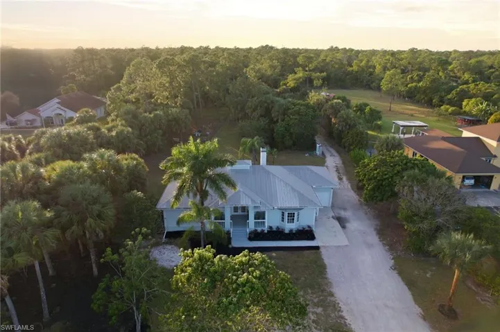 Twilight aerial showcasing the property's scale and privacy
