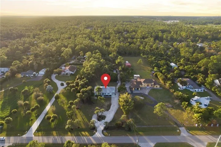 Twilight aerial showcasing the property's scale and privacy