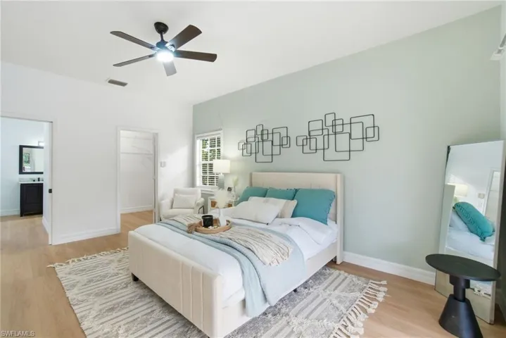 The primary suite offers a spacious walk-in closet, private ensuite bath, soothing design tones, and beautiful natural light for a truly relaxing retreat