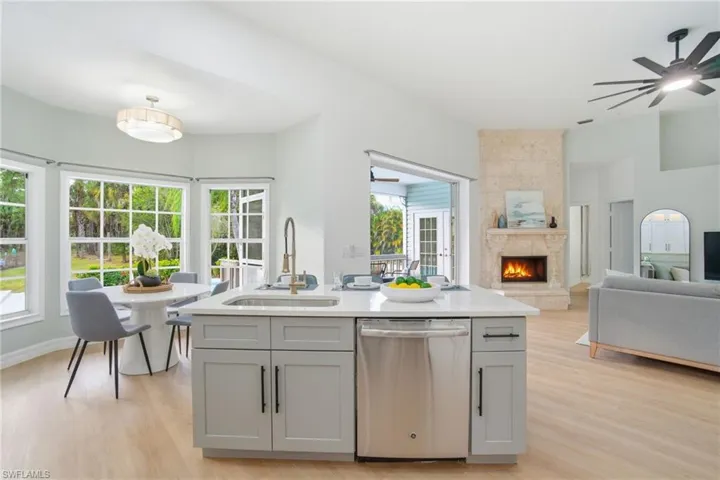 Freshly renovated spaces designed for modern living—bright kitchen, quartz counters, and a stunning custom fireplace.