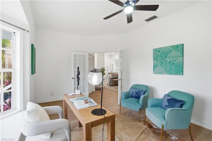 This flexible fourth bedroom offers French door entry, a lovely bay window, and a bright, inviting atmosphere—perfect for an office, guest space, or reading room.