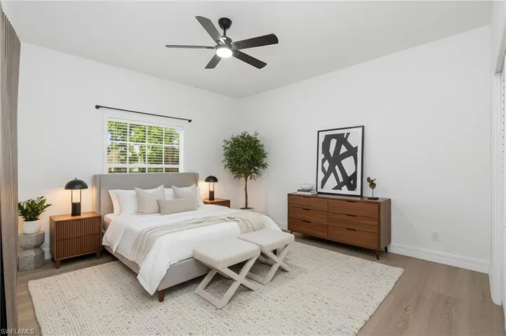 Guests will enjoy a sunlit bedroom with private French door opening directly to the deck and pool