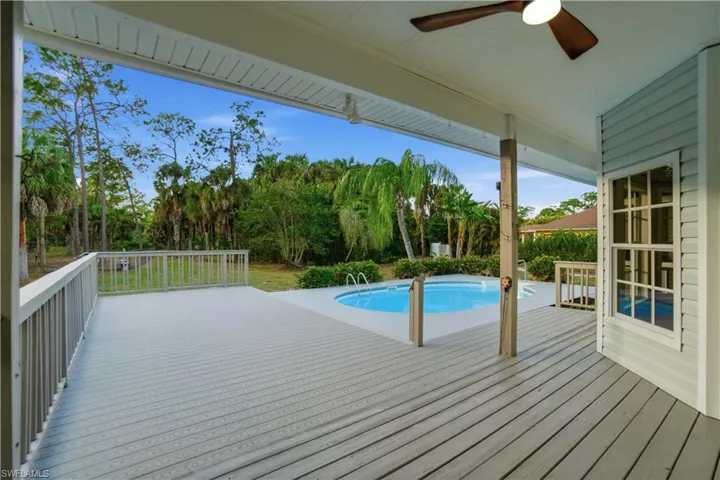A private swimming pool paired with an expansive deck for lounging and outdoor enjoyment