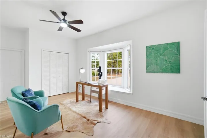 This flexible fourth bedroom offers French door entry, a lovely bay window, and a bright, inviting atmosphere—perfect for an office, guest space, or reading room.