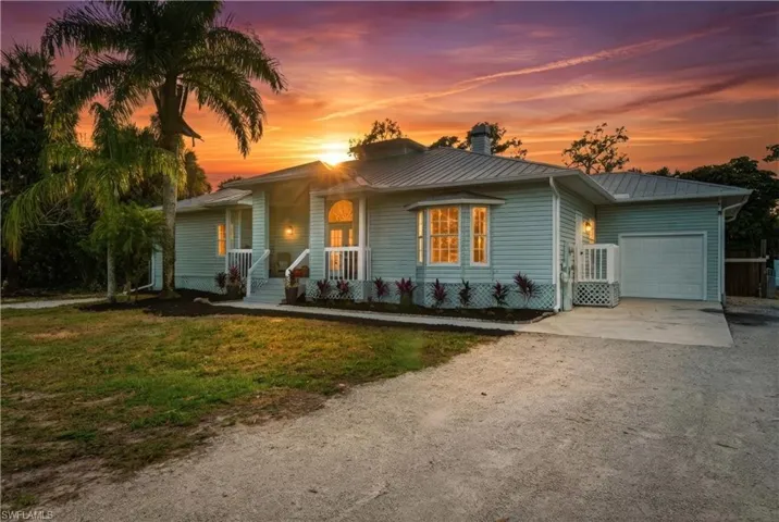 Timeless Key West architecture framed by breathtaking sunsets across 2.5 acres or tropical serenity