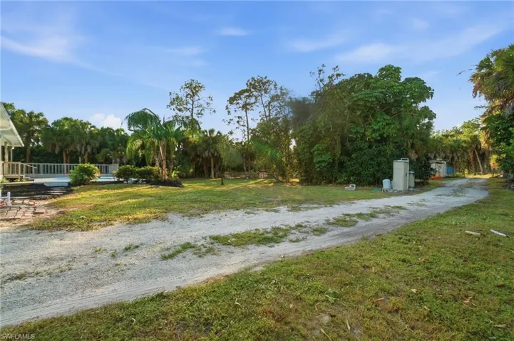 Convenient drive-around access providing entry to the rear of the property