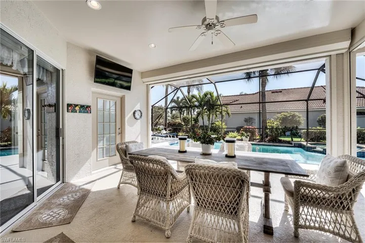 Sunroom / solarium featuring a pool
