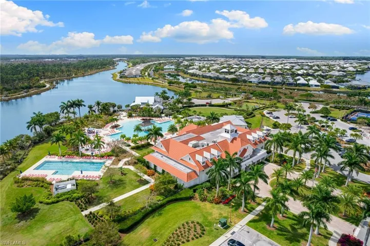 Aerial view of a pool and a large body of water