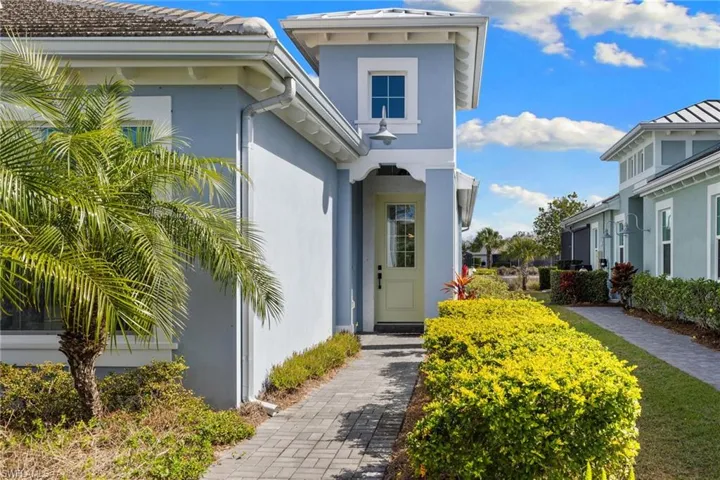 View of exterior entry with stucco siding