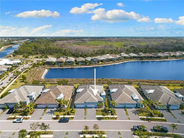 Aerial view of residential area featuring a large body of water