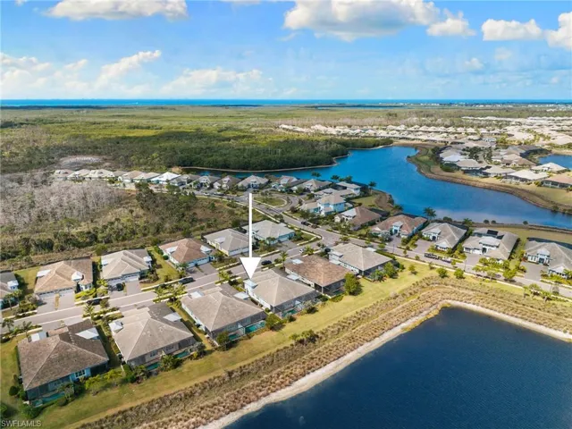 Aerial view of residential area with a nearby body of water