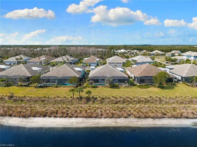 Aerial view of residential area with a large body of water